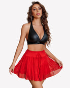 Red pleated mini skirt with tiered ruffles and tied waistband