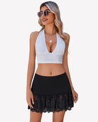 Black bodycon skirt with lace ruffle hem and gathered waistband.