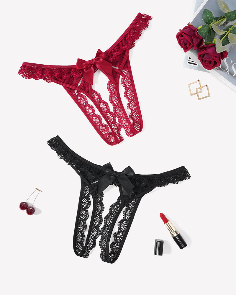 Floral lace low-rise thongs in red and black, each with a satin bow front.
