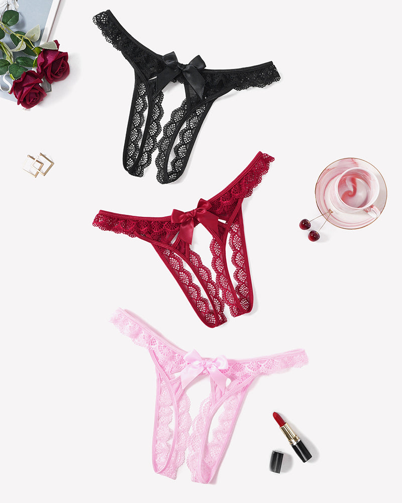 Floral lace low-rise thongs in black, red, and light pink, each with a bow front.