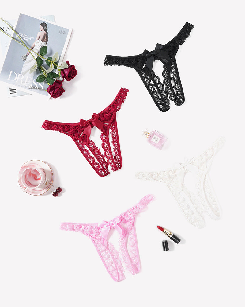 Set of floral lace low-rise thongs in black, red, pale pink, and white, each with bow ties.