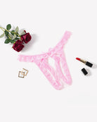 Low-rise lace thong, pink floral lace with scalloped waist edge and center bow