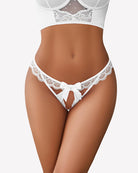 Low-rise lace thong on model, white scalloped lace edge with center bow