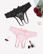 Lace thong briefs in black and light pink with bow accents, laid flat