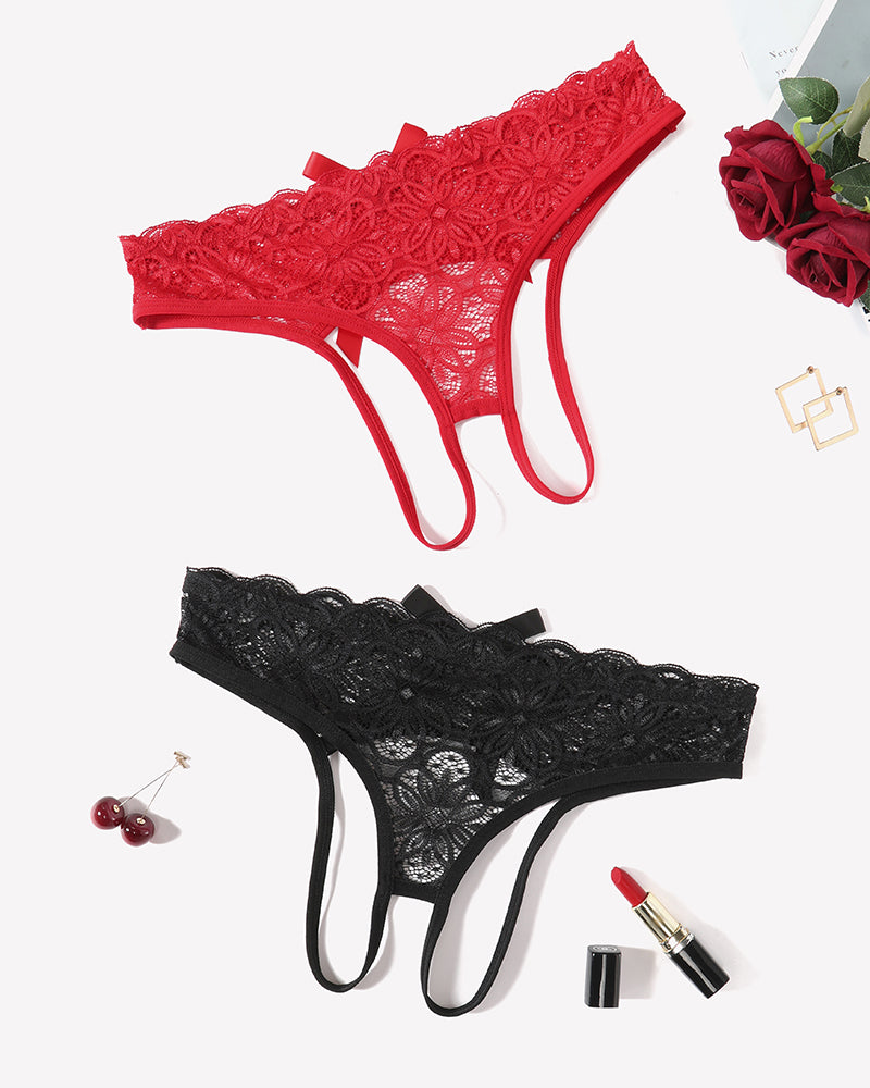 Lace thong briefs in red and black with bow accents, shown laid flat