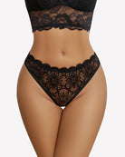 Black lace thong briefs with scalloped waistband and openwork floral pattern.