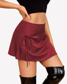 Burgundy satin A-line mini skirt with ruched front and side tie strings