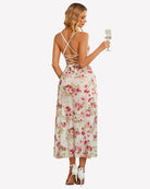 Back view of floral mesh side-split nightgown with crisscross straps and long skirt slit