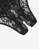 Close-up of floral lace briefs hem in black with scalloped edge and sheer mesh