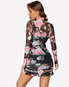 Sheer long sleeve dress in black with pink floral print, ruched waist, short ruffled hem