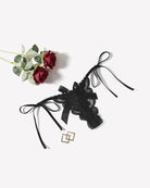 Black floral lace thong with ribbon ties and a bow accent