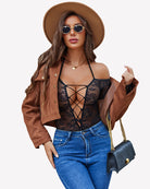 Black lace teddy bodysuit with cutout crisscross front and long sleeves