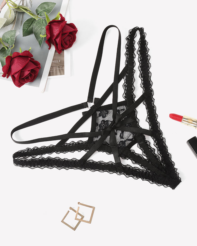 Black lace panties with criss-cross straps and bow detail