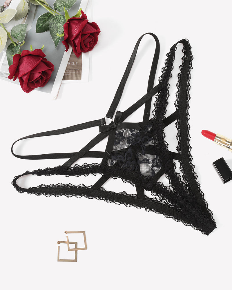 Black lace panties with criss-cross straps and central bow