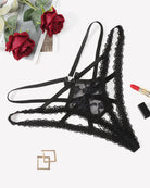 Black lace panties with criss-cross straps and central bow