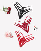 Assorted lace panties with criss-cross straps, including black and red