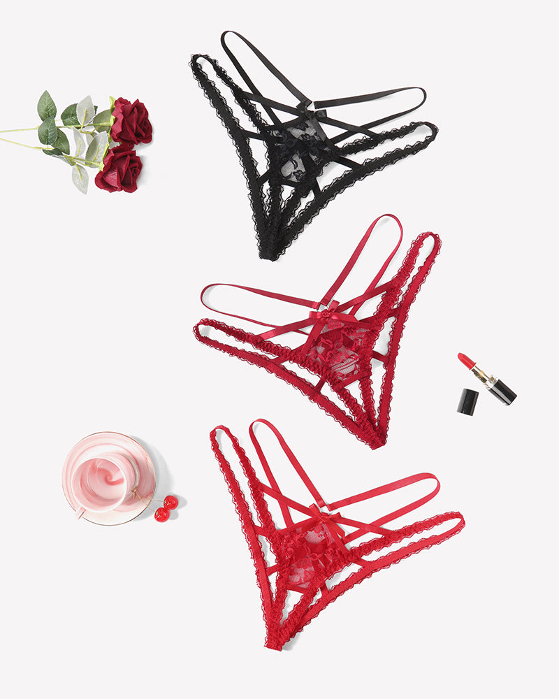 Assorted lace panties with criss-cross straps, including black and red