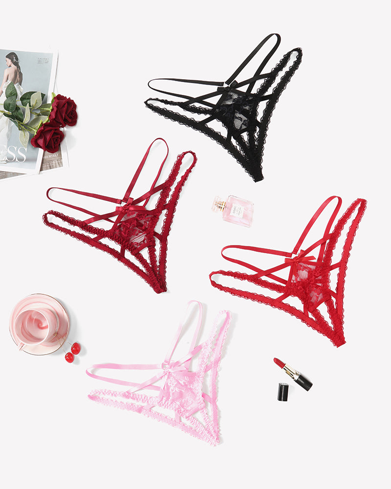 Assorted lace panties with criss-cross straps in black, red, and pink