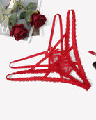 Red lace thong panties with crisscross tie straps and scalloped lace trim