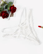 White lace thong panties with crisscross tie straps and scalloped lace trim