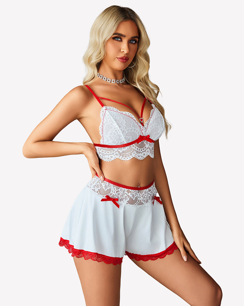 White lace bralette and satin shorts set with sheer robe, red bow and trim