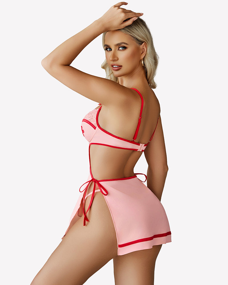 Pink nighty dress with lace trim, back tie straps, and leg-cutout