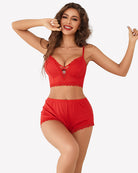 Red lace-trim cami pajama set with heart-detail bralette and matching shorts