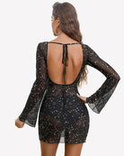 Backless mesh mini dress with star constellation print, tie-back and flared sleeves.