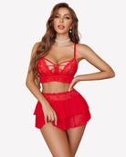 Red lace bralette with crisscross neckline and ruffled mini skirt