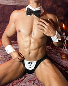 Black tuxedo-style brief set with bow tie and white buttoned front