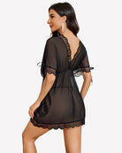 Black mesh short-sleeve dress with lace back yoke, tied waist, scalloped hem