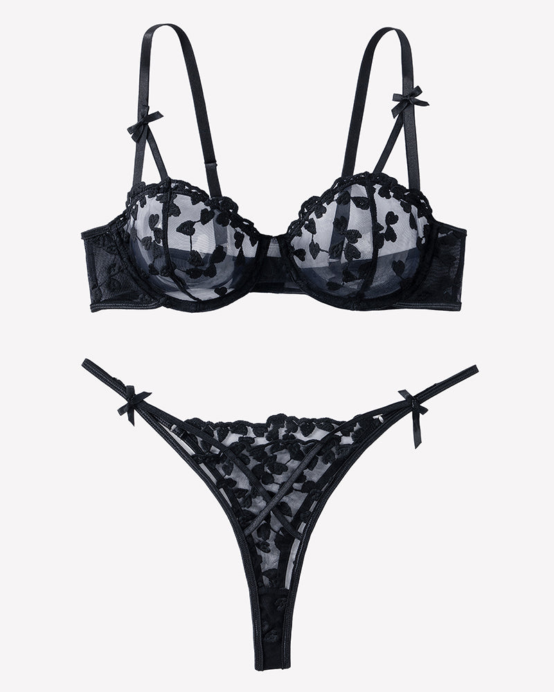 Black lace bra and thong set with heart pattern and bow strap accents