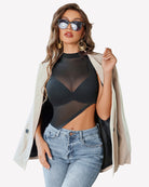 Sheer mock neck tank top with asymmetrical cut, solid black front view
