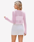 Sheer cropped cardigan, long sleeves, open front in pastel light purple (back view).