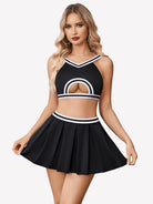 Hollow crop top and pleated skirt set, black with white trim and front arch cutout