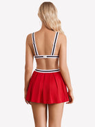 Hollow crop top and pleated skirt set, red back view with white-trim straps and pleated skirt