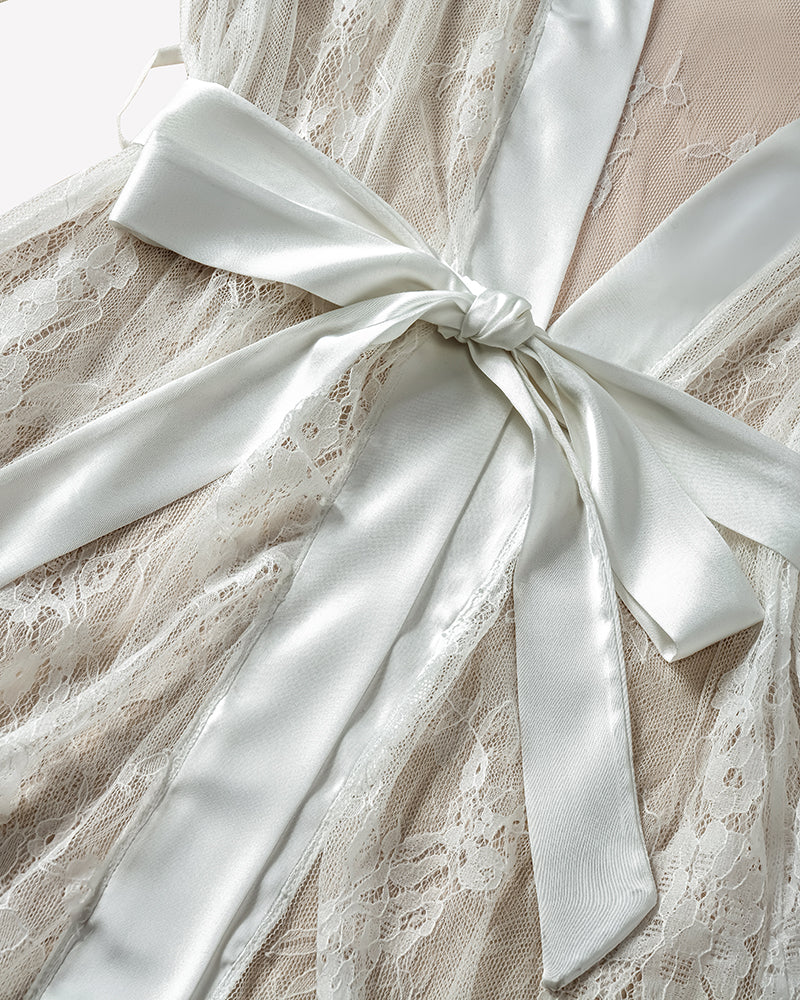 White satin-and-lace nightgown robe detail with bow-tied waist and lace texture