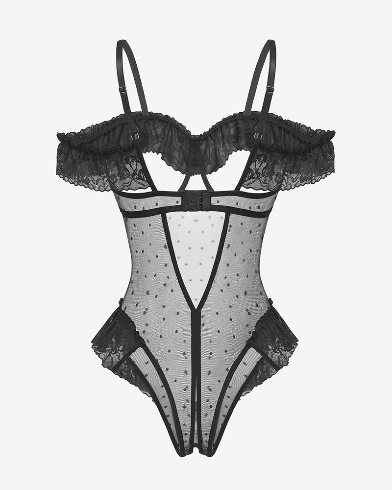 Black sheer mesh bodysuit with harness-style straps, off-shoulder ruffle trim and bow motifs