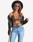 Black dotted strappy bra and thong panty set with triangle cups and adjustable straps