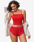 Ribbed pajama set in red: spaghetti-strap cropped cami top and elastic-waist shorts