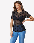 Black mesh sheer crew neck blouse with star print, short sleeves.