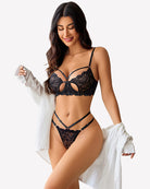 Black lace bra and panty set with butterfly cutout and strappy garter straps