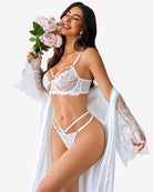 White lace bra and panty set with butterfly-shaped cutout, strappy harness