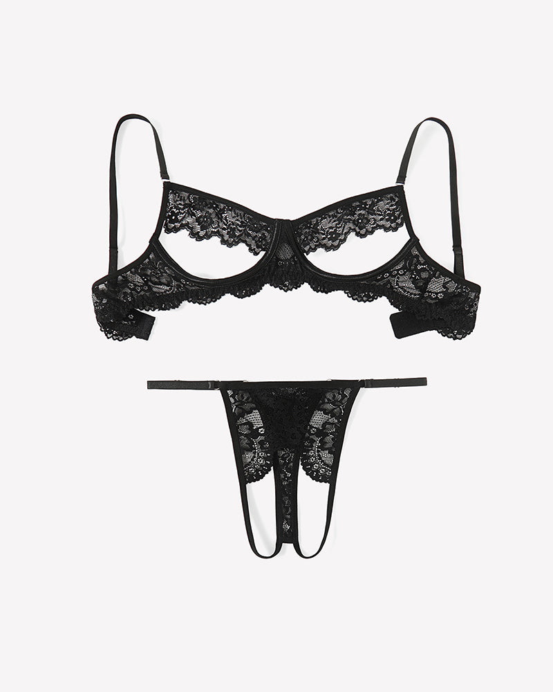 Black floral lace cutout bra and matching thong set, flat lay with scalloped edges.