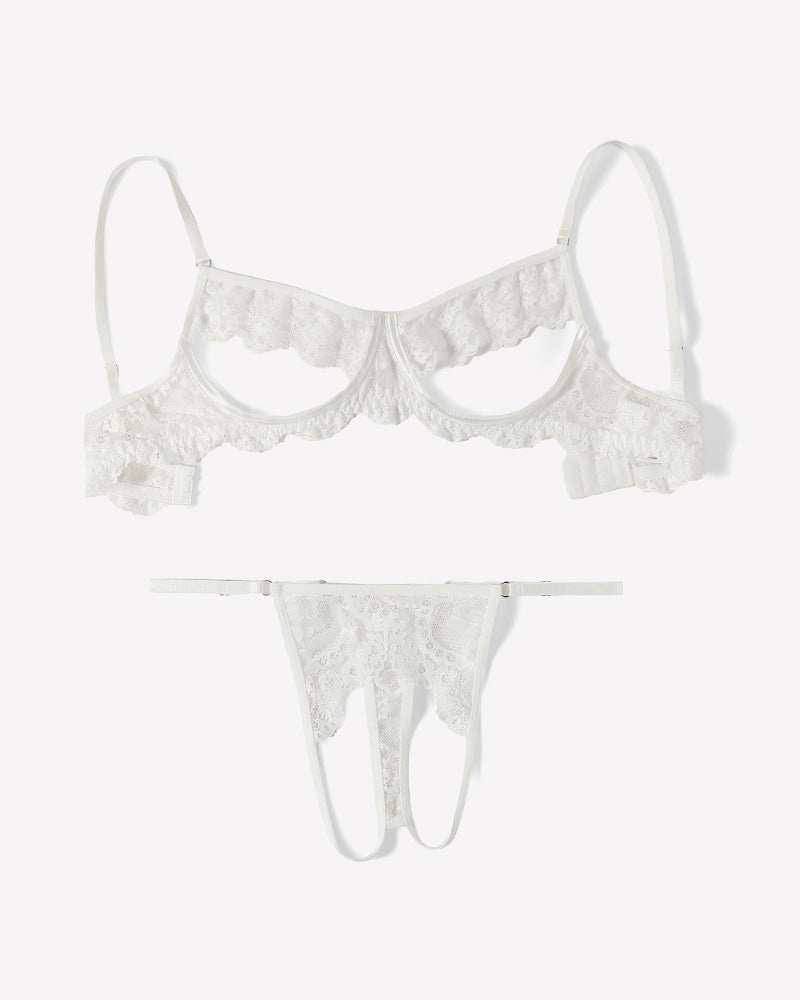 White floral lace cutout bra and matching thong set, flat lay with scalloped edges.