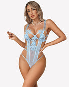 Light blue lace bodysuit with deep V cups, floral embroidery, and cutout harness