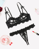 Black lace bra and thong set with cutout mesh panels and bow straps