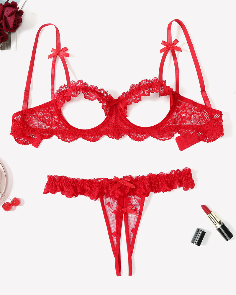 Red lace push-up bra and matching cutout panty set, flat lay.
