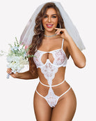 White lace teddy with underwire cups, V-shaped front cutout, and strappy thong back