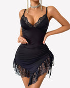 Ruched mini dress in black with lace V-neck and scalloped lace hem, spaghetti straps